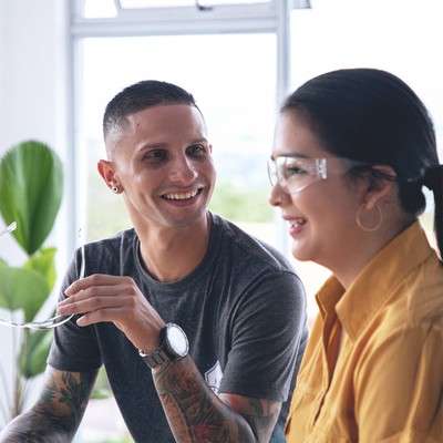 two colleagues share a moment of connection and accomplishment