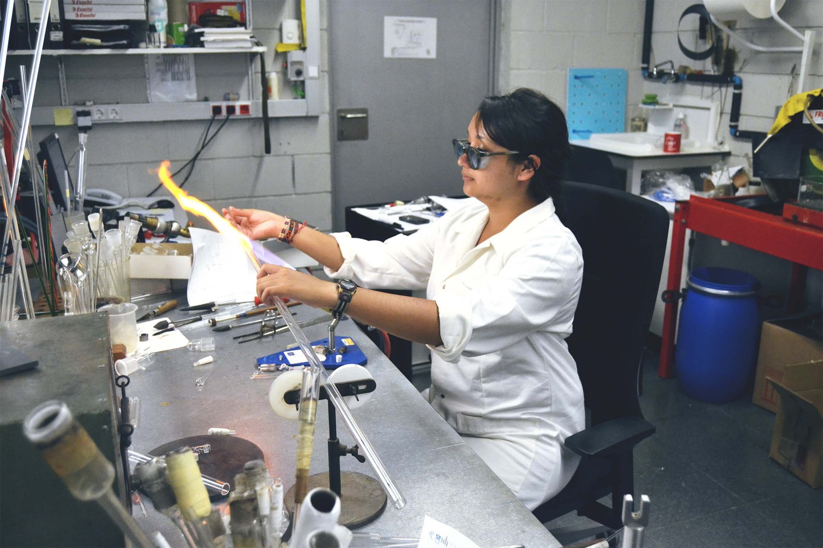 ta corrales blowing glass in a laboratory