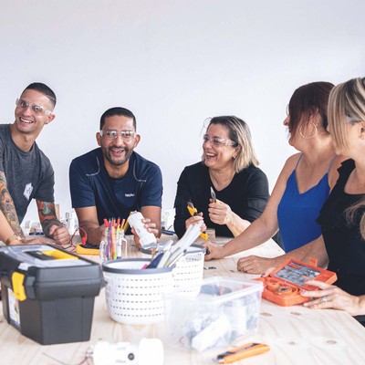 a diverse team bonds with one another during a smith assembly workshop