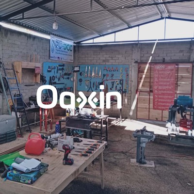 oaxin’s innovation center in suchilquitongo with concrete walls, a ventilated metal roof, wooden workbenches, and hundreds of hand- and power-tools