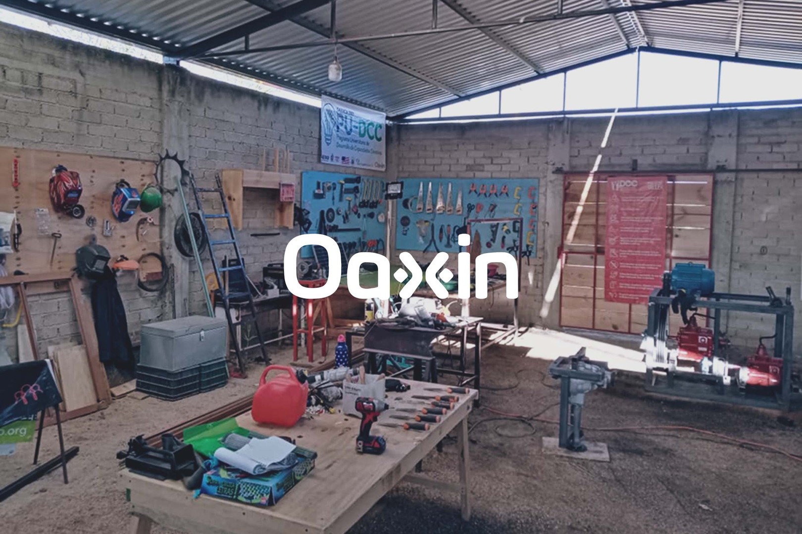 oaxin’s innovation center in suchilquitongo with concrete walls, a ventilated metal roof, wooden workbenches, and hundreds of hand- and power-tools