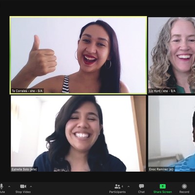 a screenshot of a zoom call in which the four participants are laughing